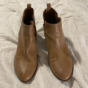 Tan ankle high booties by Guess